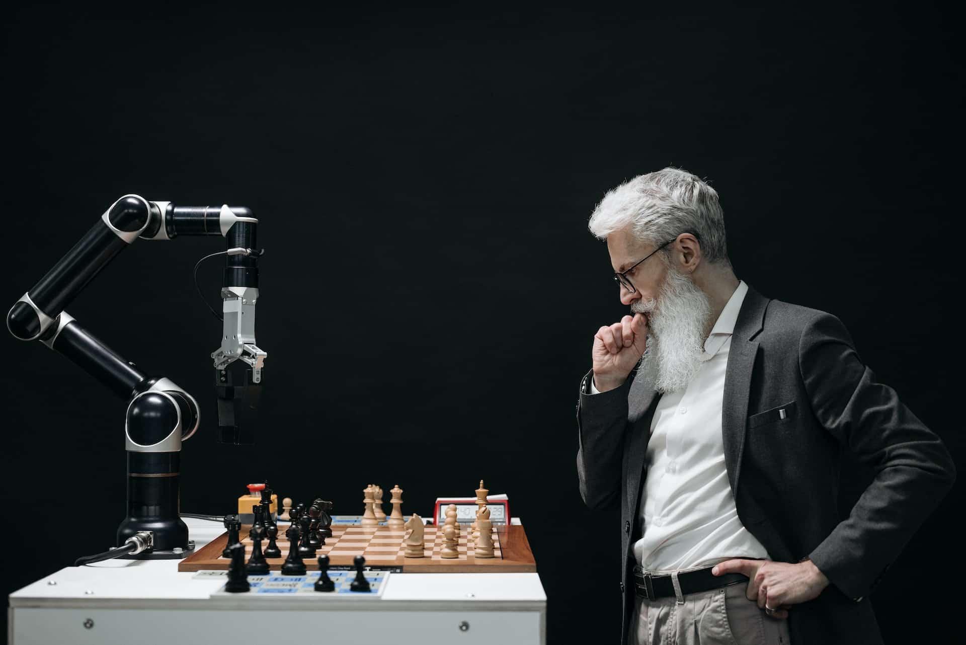 an elderly man is playing chess as a Hobby